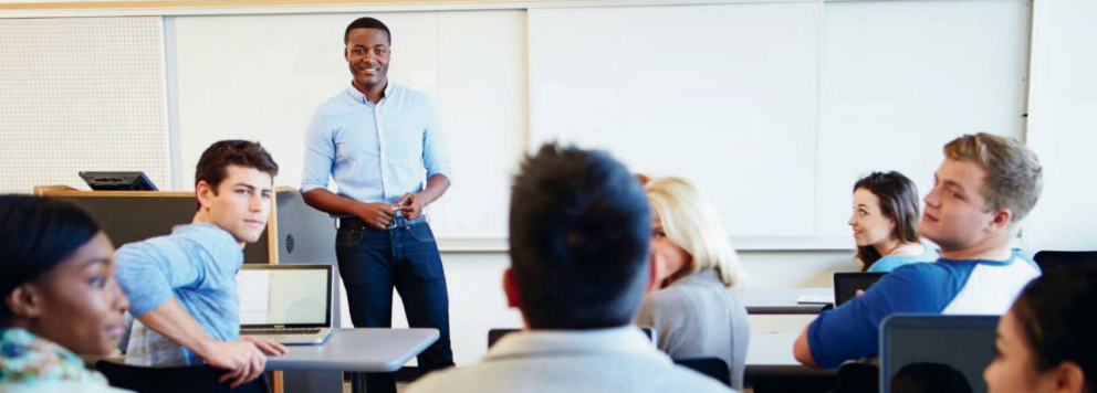 Teacher standing in front of a classroom of students