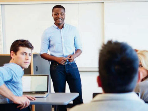 Teacher standing in front of a classroom of students